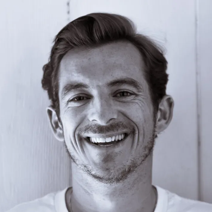 grayscale photography of man smiling